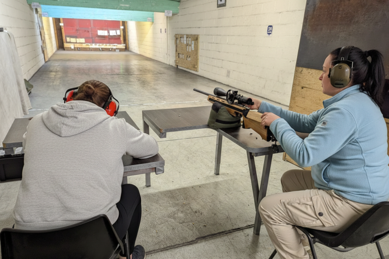 Precision shooting session focusing on firearm safety and handling